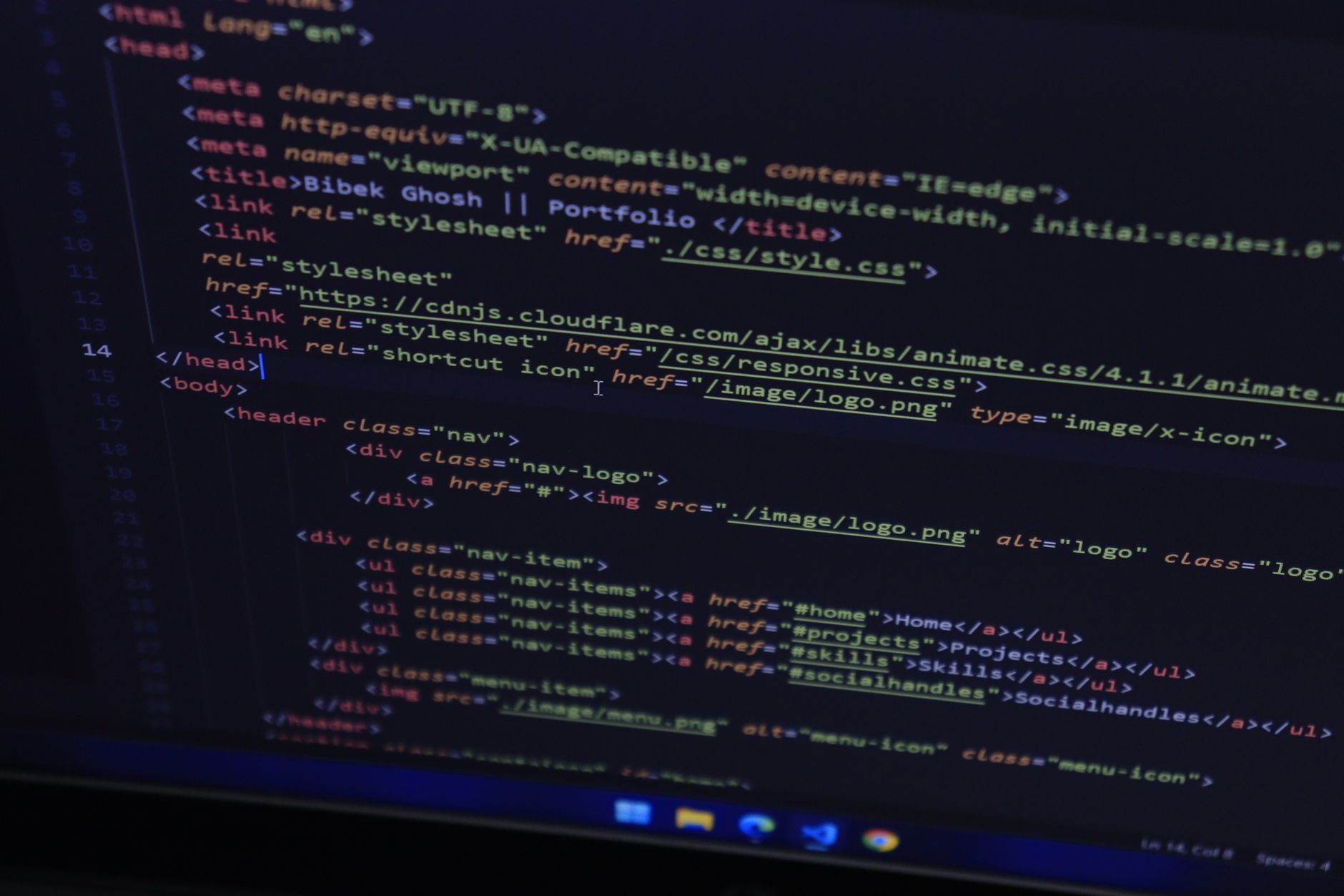 High-resolution close-up of HTML code displayed on a computer screen, perfect for technology themes.