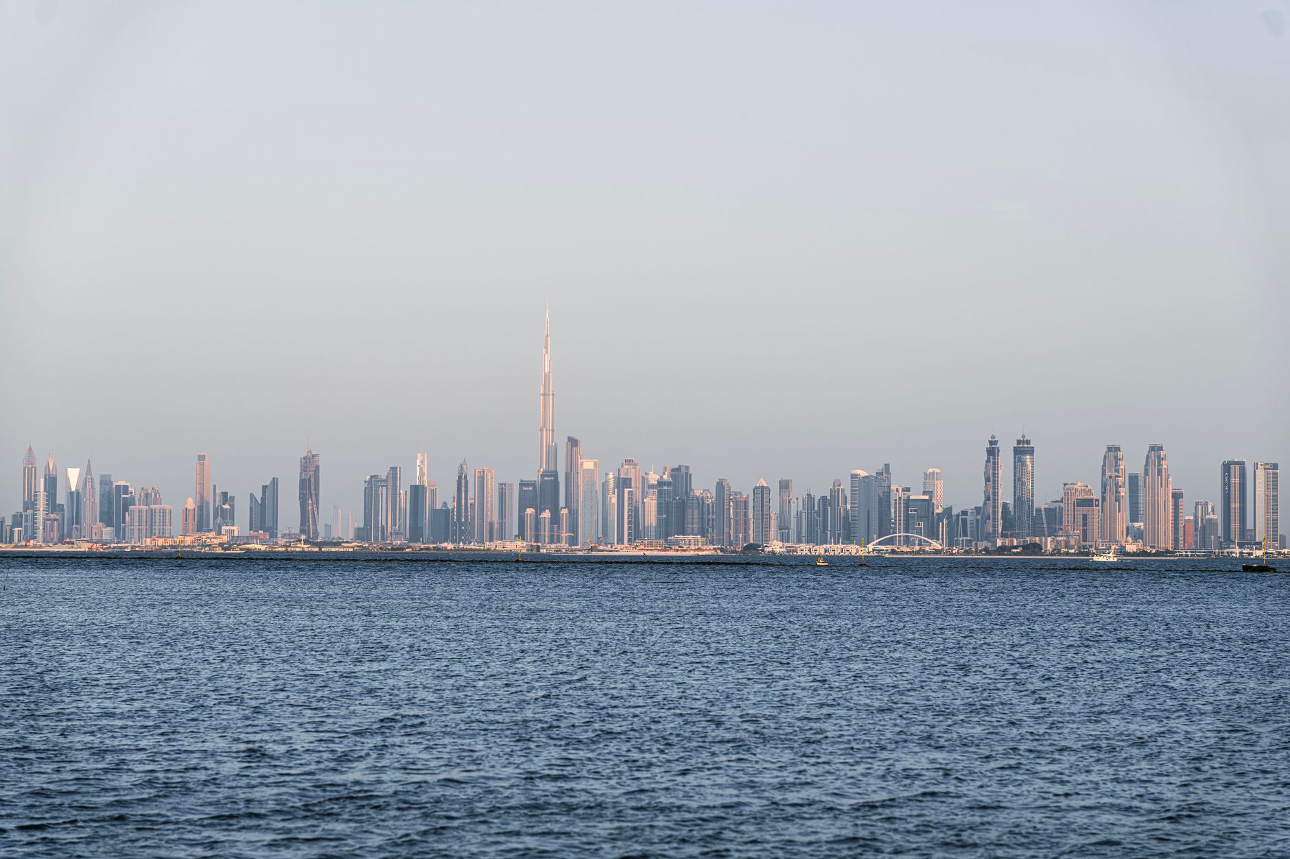 A stunning view of Dubai's skyline featuring Burj Khalifa across the sea.