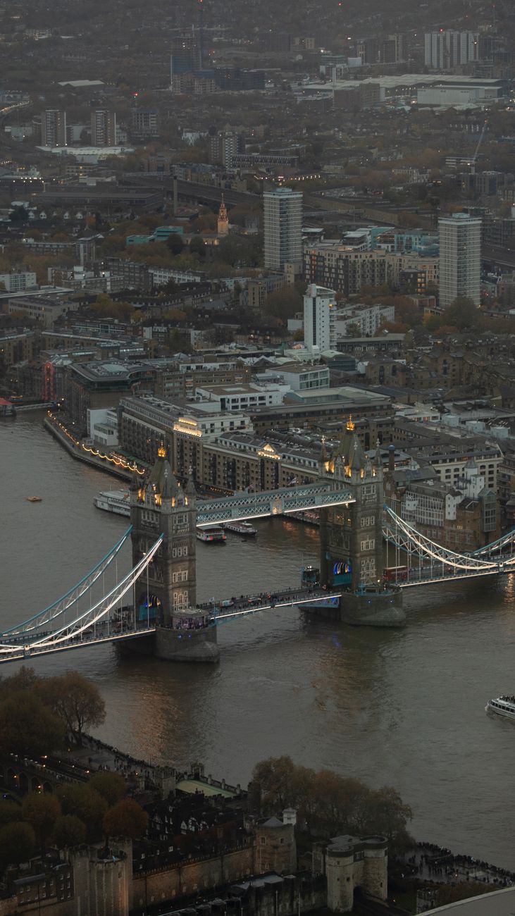 Tower Bridge elegantly lit against the evening sky in London, UK.
