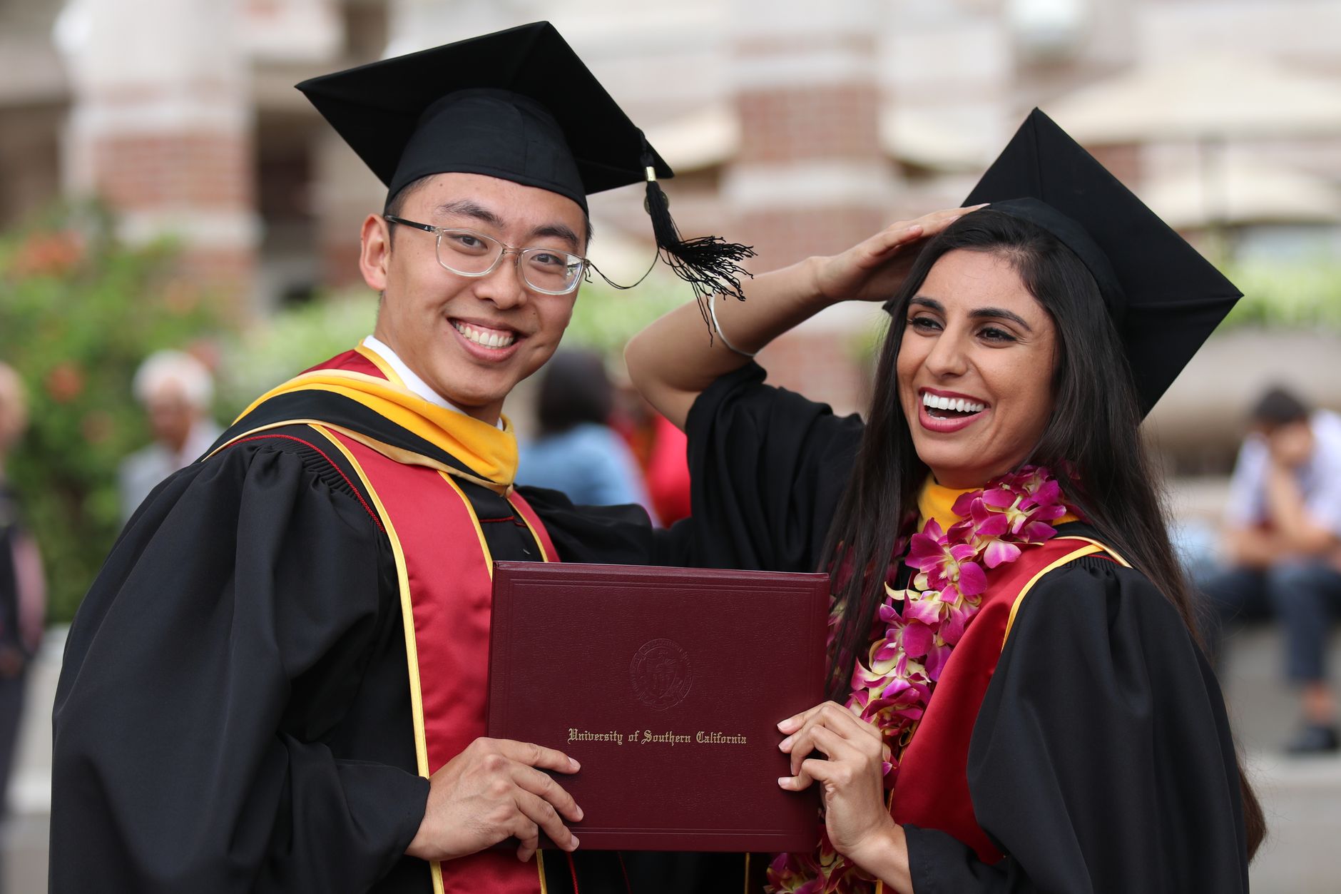 Happy graduates celebrating their achievement at University of Southern California.